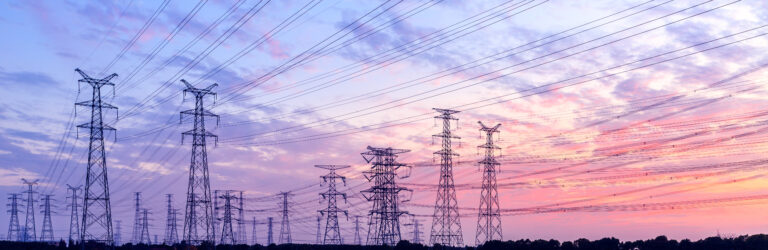 high-voltage power lines at sunset,high voltage electric transmi